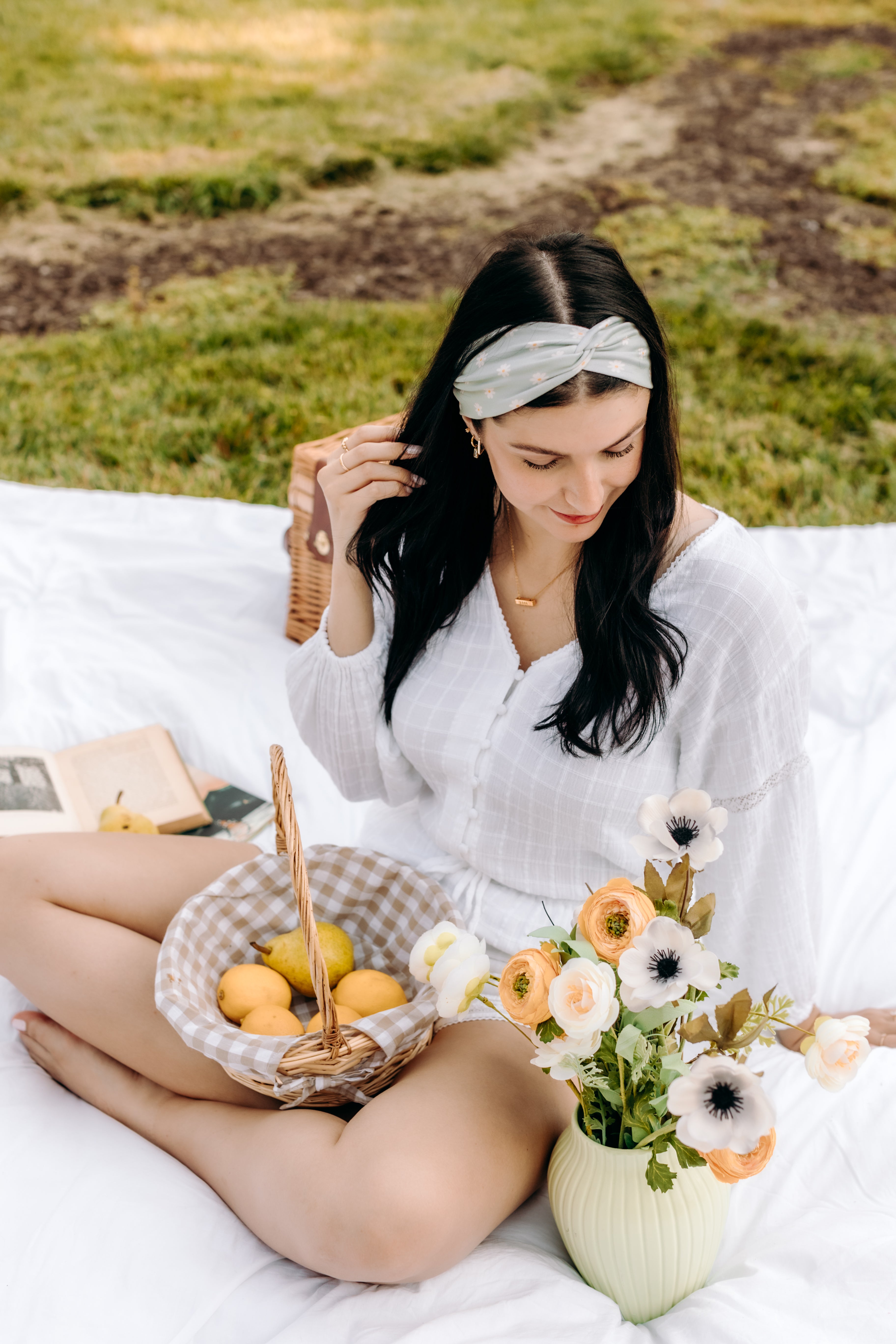 Woman with long hair happily wearing the most comfortable hand-made headband in the print Wren Floral.
