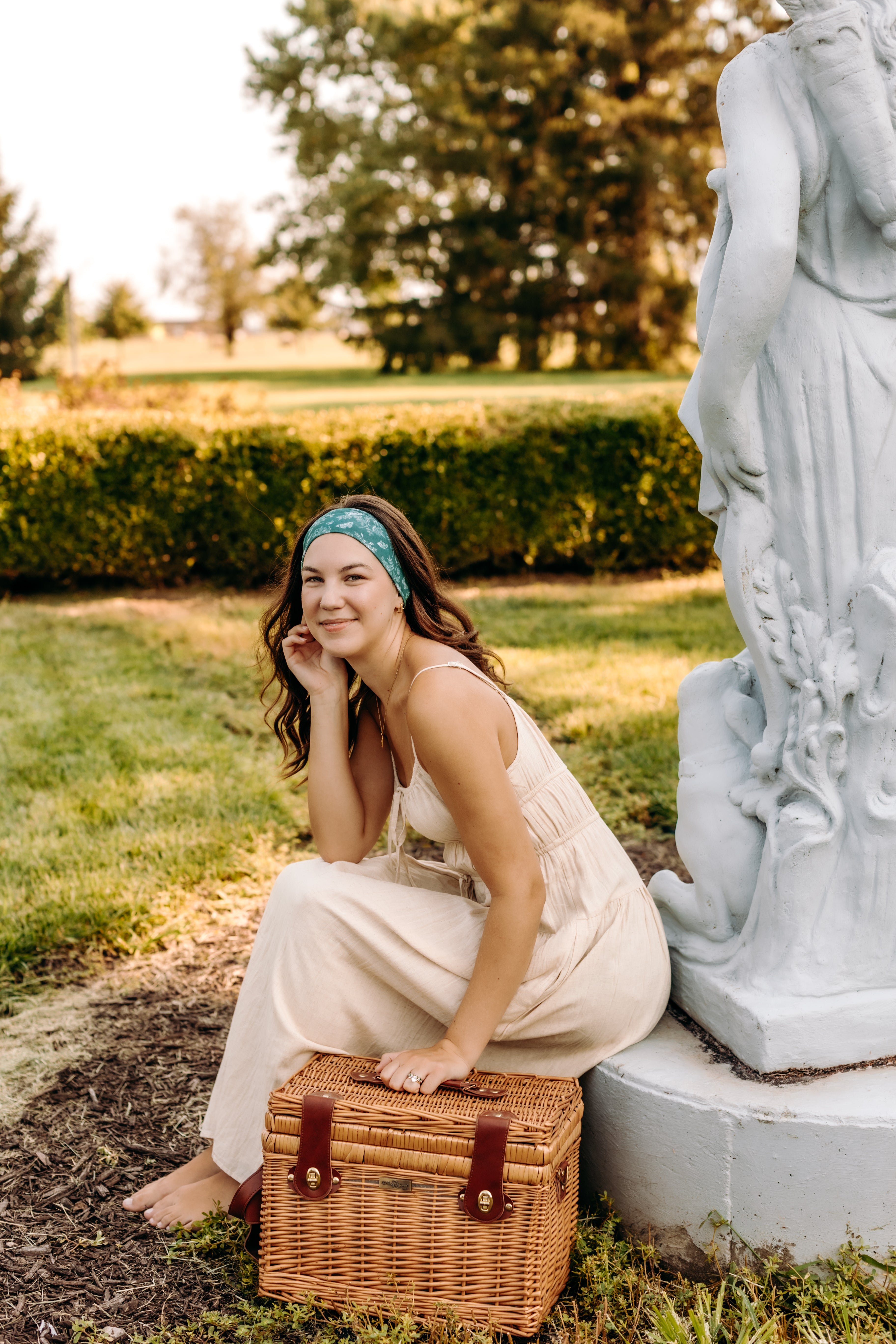 Woman with long hair happily wearing the most comfortable hand-made headband in the print Arwen Floral.