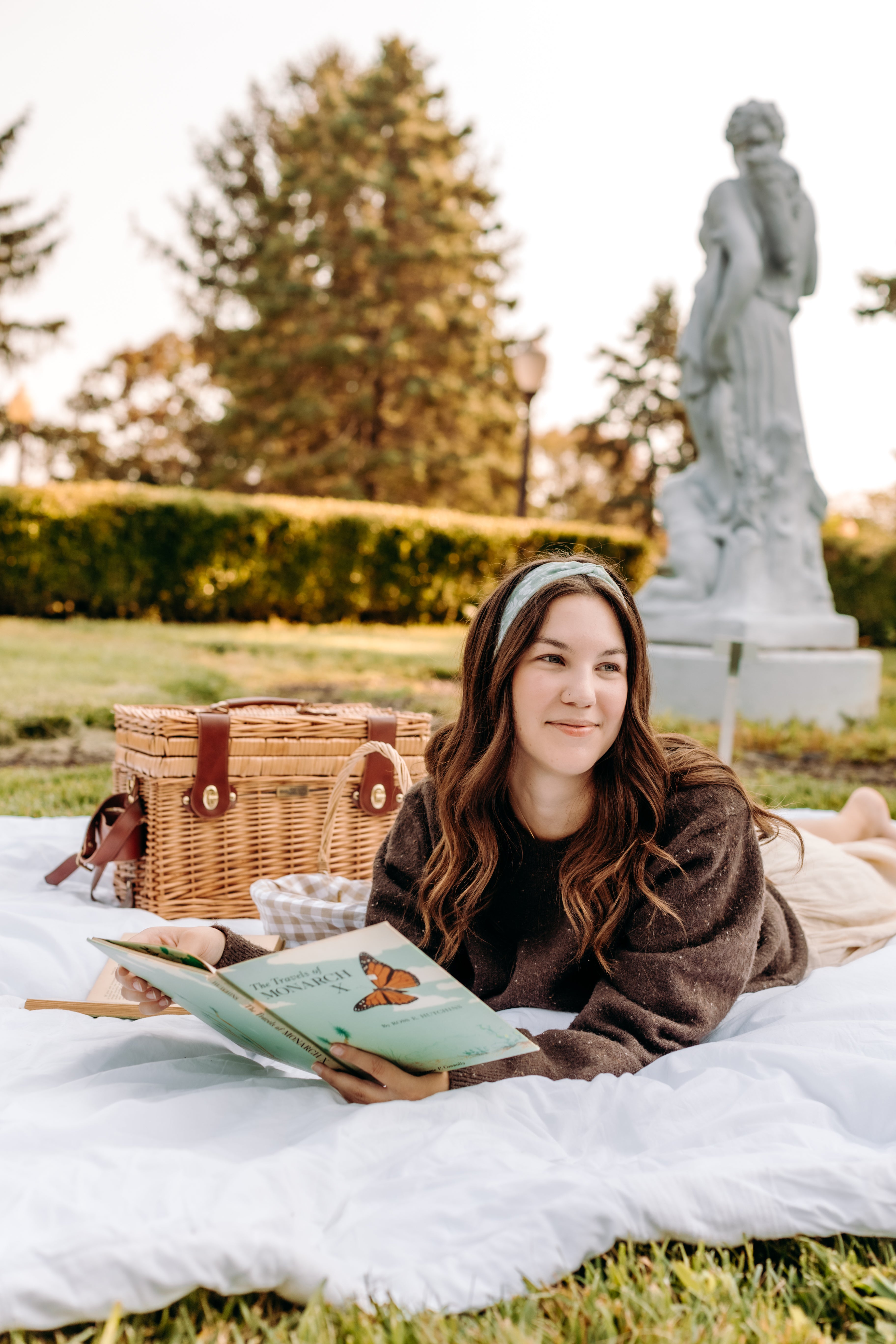 Woman with long hair happily wearing the most comfortable hand-made headband in the print Hazel Floral.