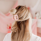 Checking In Lilac Clip: a 2-inch glossy checkered claw clip with a hinge closure, perfect for styling and keeping hair in place.