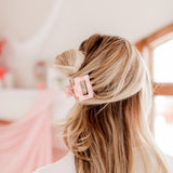 Checking In Lilac Clip: a 2-inch glossy checkered claw clip with a hinge closure, perfect for styling and keeping hair in place.