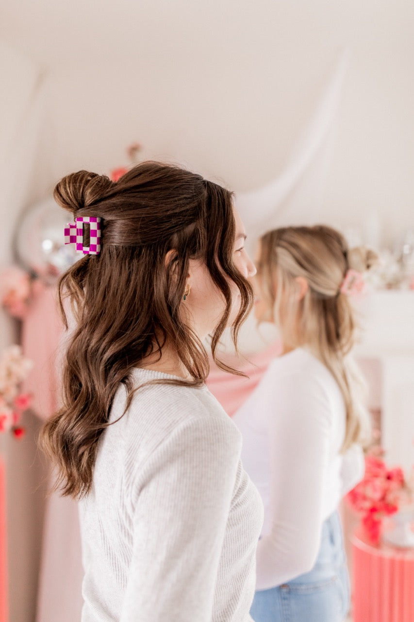 Checking In Lilac Clip: a 2-inch glossy checkered claw clip with a hinge closure, perfect for styling and keeping hair in place.