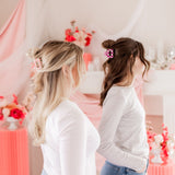 Checking In Lilac Clip: a 2-inch glossy checkered claw clip with a hinge closure, perfect for styling and keeping hair in place.