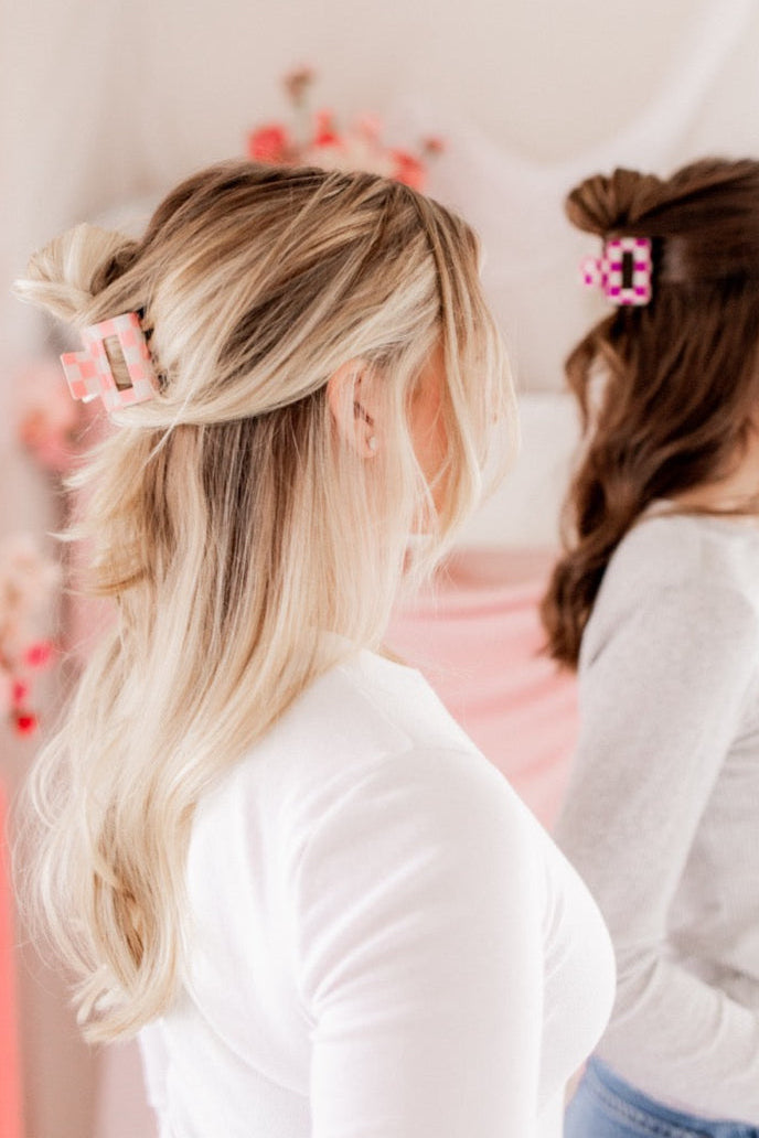 Checking In Lilac Clip: a 2-inch glossy checkered claw clip with a hinge closure, perfect for styling and keeping hair in place.