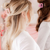 Checking In Lilac Clip: a 2-inch glossy checkered claw clip with a hinge closure, perfect for styling and keeping hair in place.