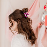 Checking In Lilac Clip: a 2-inch glossy checkered claw clip with a hinge closure, perfect for styling and keeping hair in place.