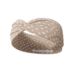 Tan headband from The Sarah Wallace Collection featuring white crosses, versatile 3-in-1 twist style, ultra-stretchy poly-knit blend, and non-slip, sweat-absorbent double-layer fabric.