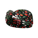 Feelin' Berry Good headband featuring red flowers and strawberries on a black background. Ultra-stretchy, non-slip, and machine washable for versatile wear.