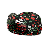 Feelin' Berry Good headband featuring red flowers and strawberries on a black background. Ultra-stretchy, non-slip, and machine washable for versatile wear.