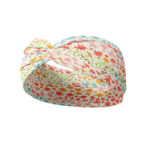 Emily Floral in Ivory headband featuring lines of pink, blue, red yellow and green flowers outlines, crafted from a buttery-soft, ultra-stretchy poly-knit blend, designed for versatility and comfort.