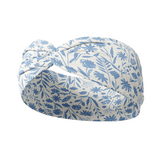 Olivia Floral on Ivory headband with a knot and blue floral pattern. Versatile 3-in-1 twist style, sweat absorbent, non-slip, machine washable. Designed for confidence and function.