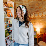 Woman confidently wearing the Hungry for Reading headband for cute hairstyles and comfortable all-day wear.