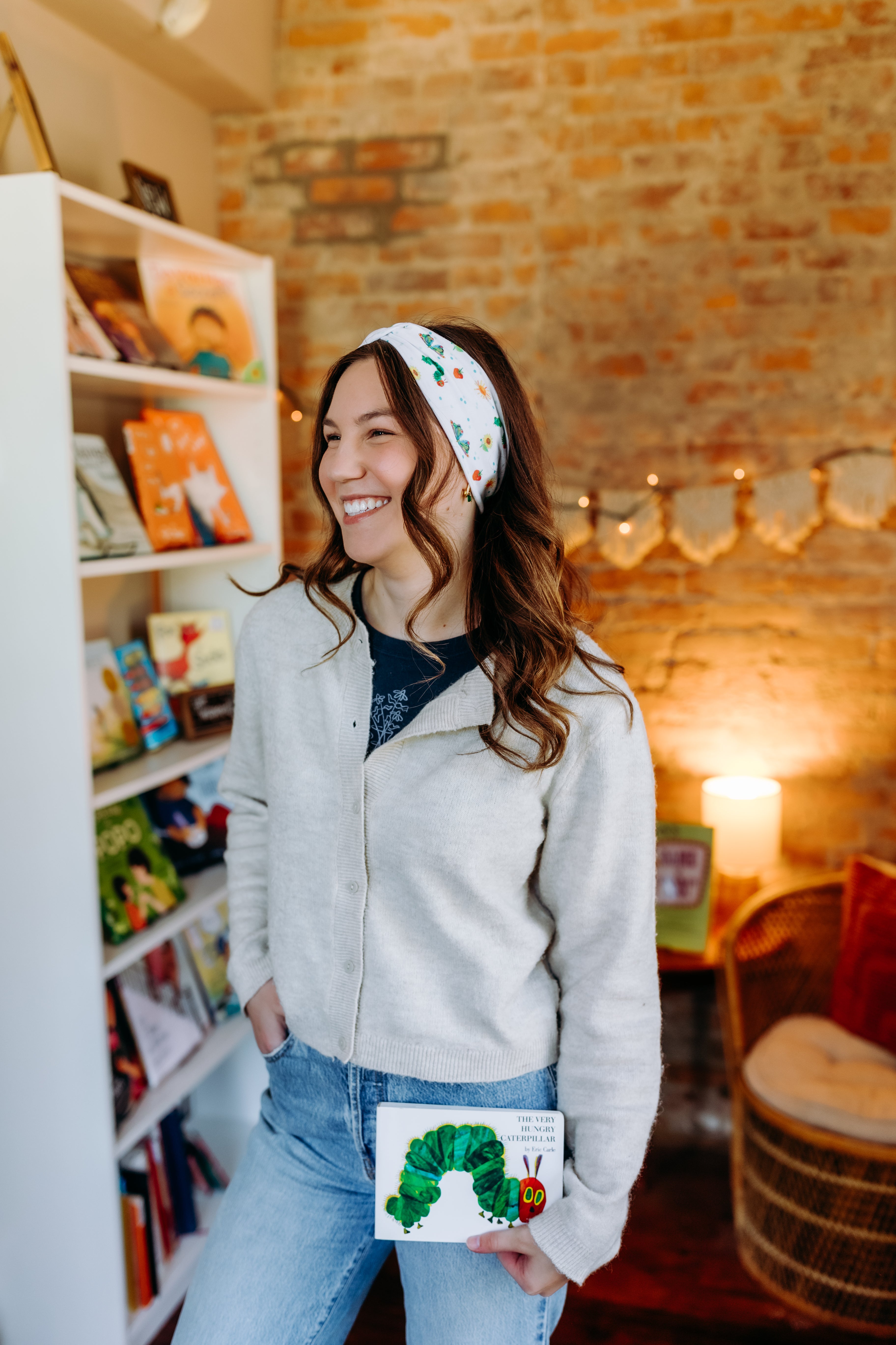 Woman confidently wearing the Hungry for Reading headband for cute hairstyles and comfortable all-day wear.