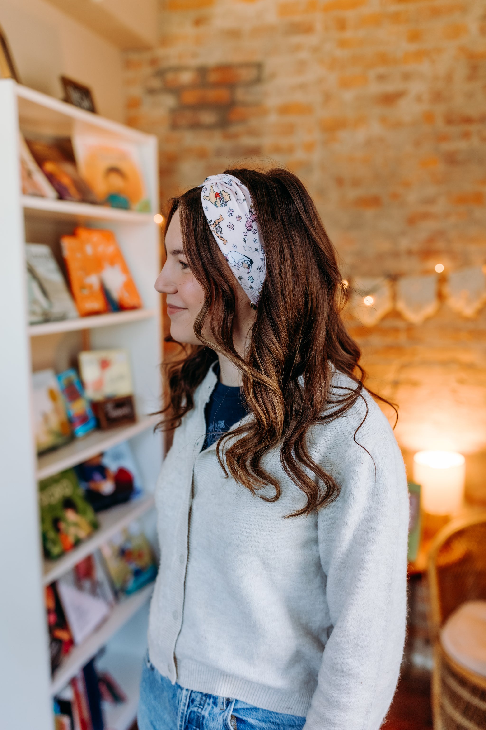 Woman confidently wearing the Limited Edition Hunny & Friends headband for cute hairstyles and comfortable all-day wear.