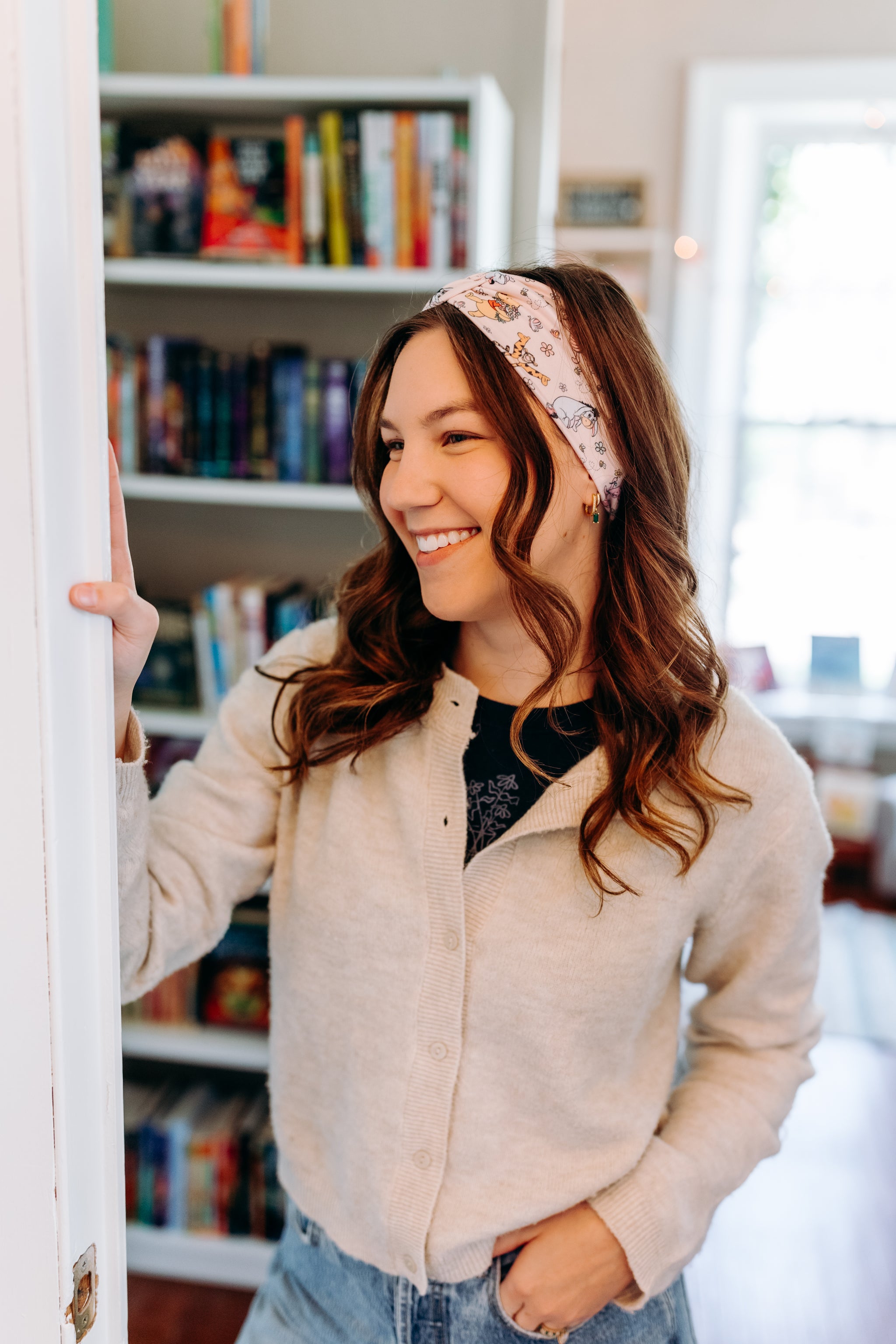 Woman confidently wearing the Limited Edition Hunny & Friends headband for cute hairstyles and comfortable all-day wear.