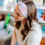 Woman confidently wearing the Lavender Library Lover headband for cute hairstyles and comfortable all-day wear.
