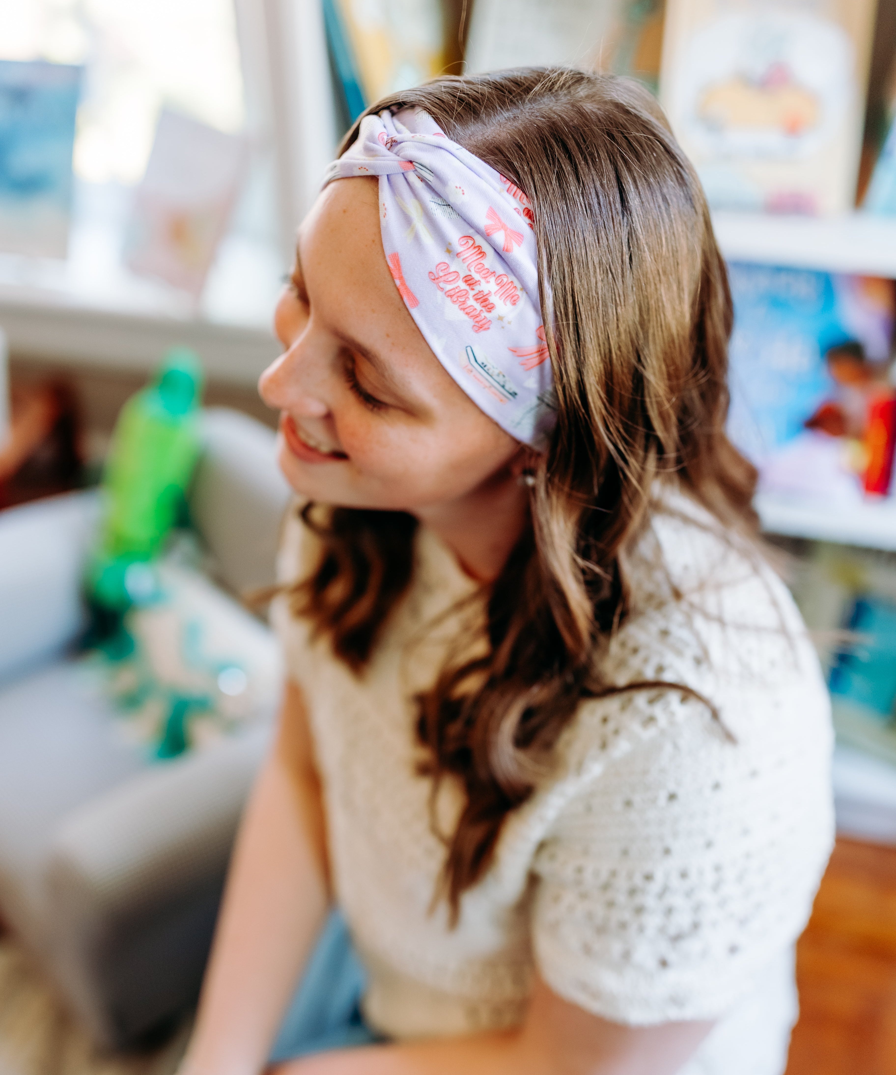 Woman confidently wearing the Lavender Library Lover headband for cute hairstyles and comfortable all-day wear.