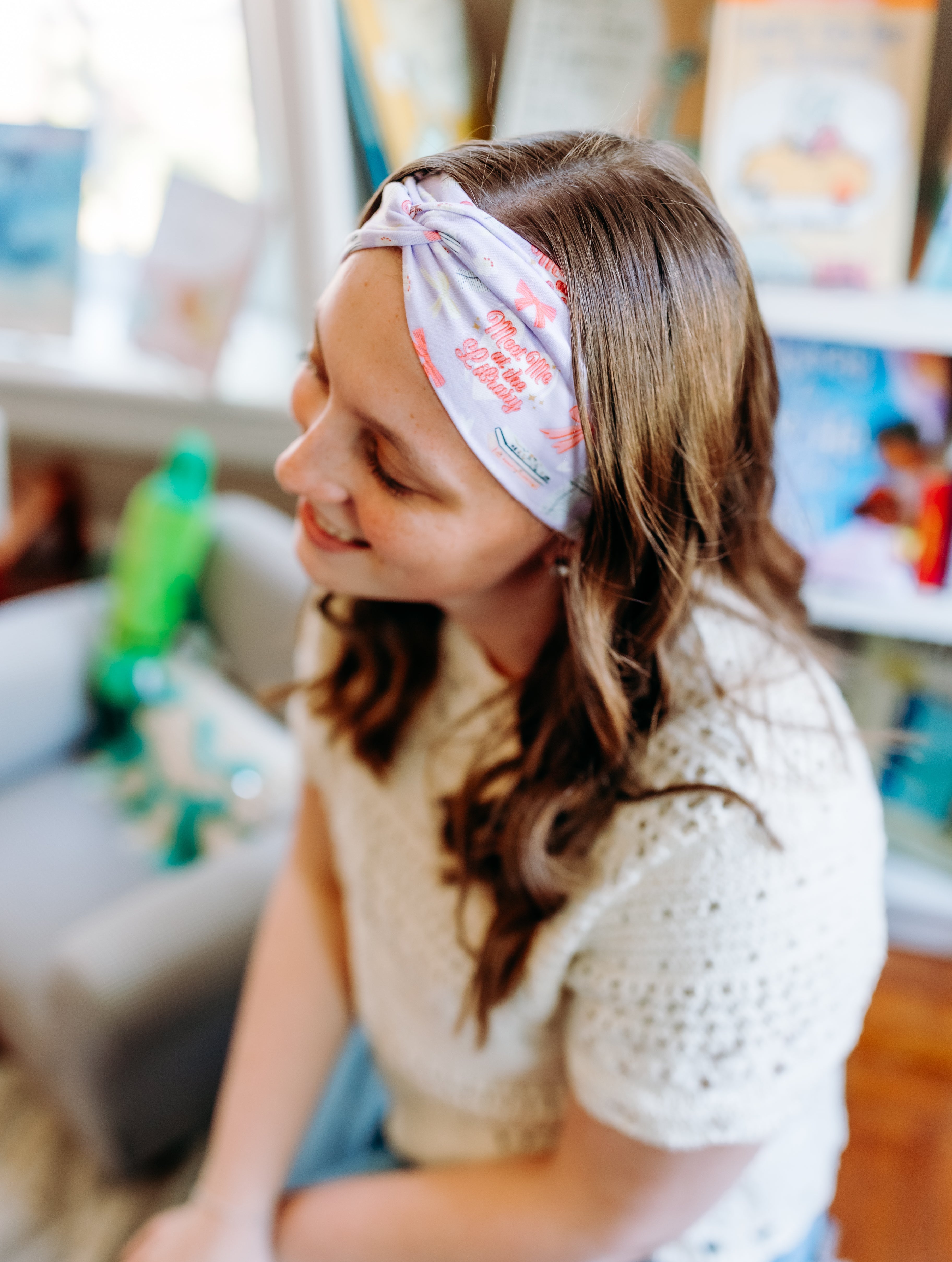 Woman confidently wearing the Lavender Library Lover headband for cute hairstyles and comfortable all-day wear.