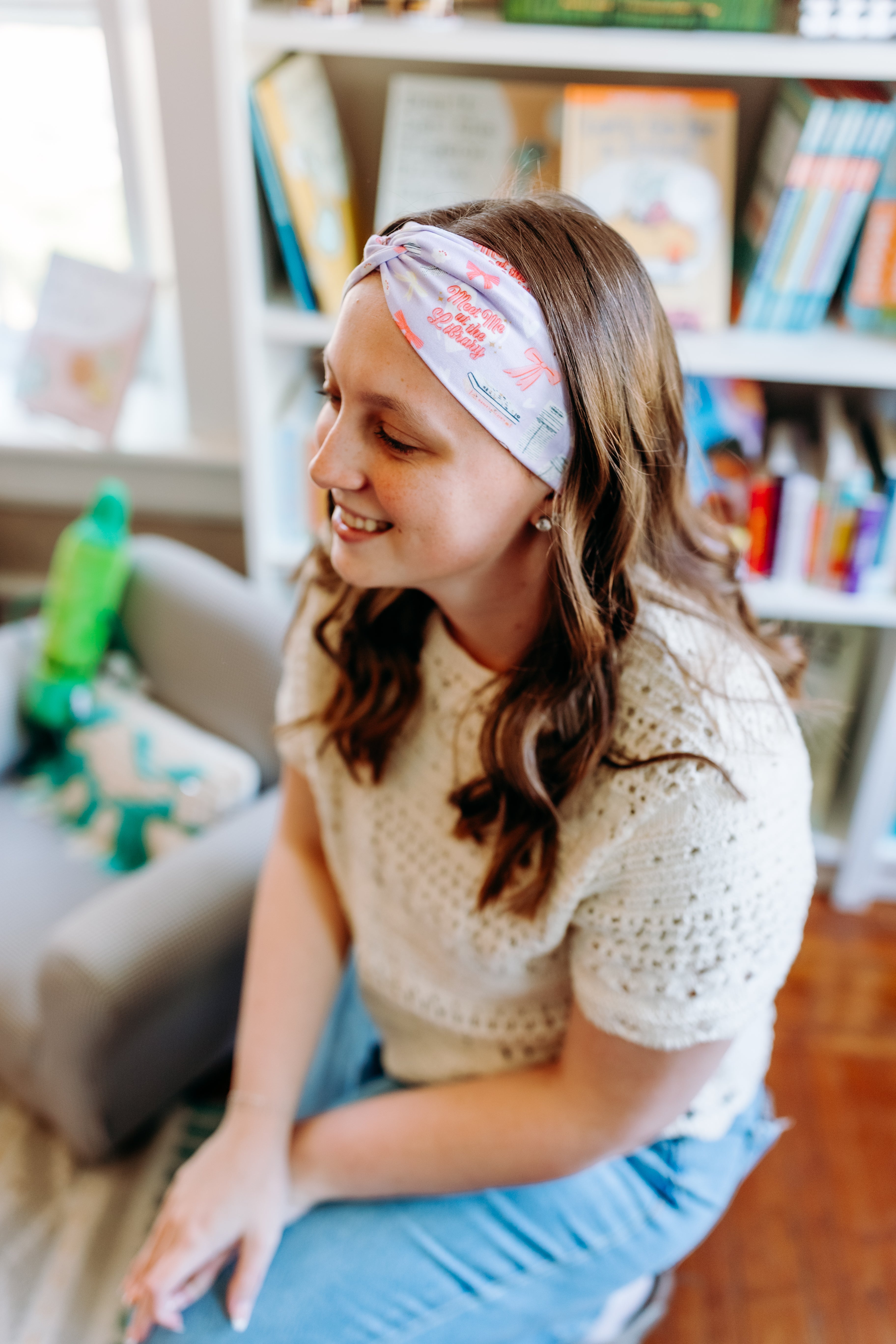 Woman confidently wearing the Lavender Library Lover headband for cute hairstyles and comfortable all-day wear.
