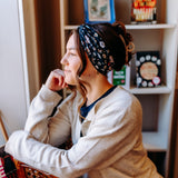 Woman confidently wearing the Bloom & Blaze headband for cute hairstyles and comfortable all-day wear.