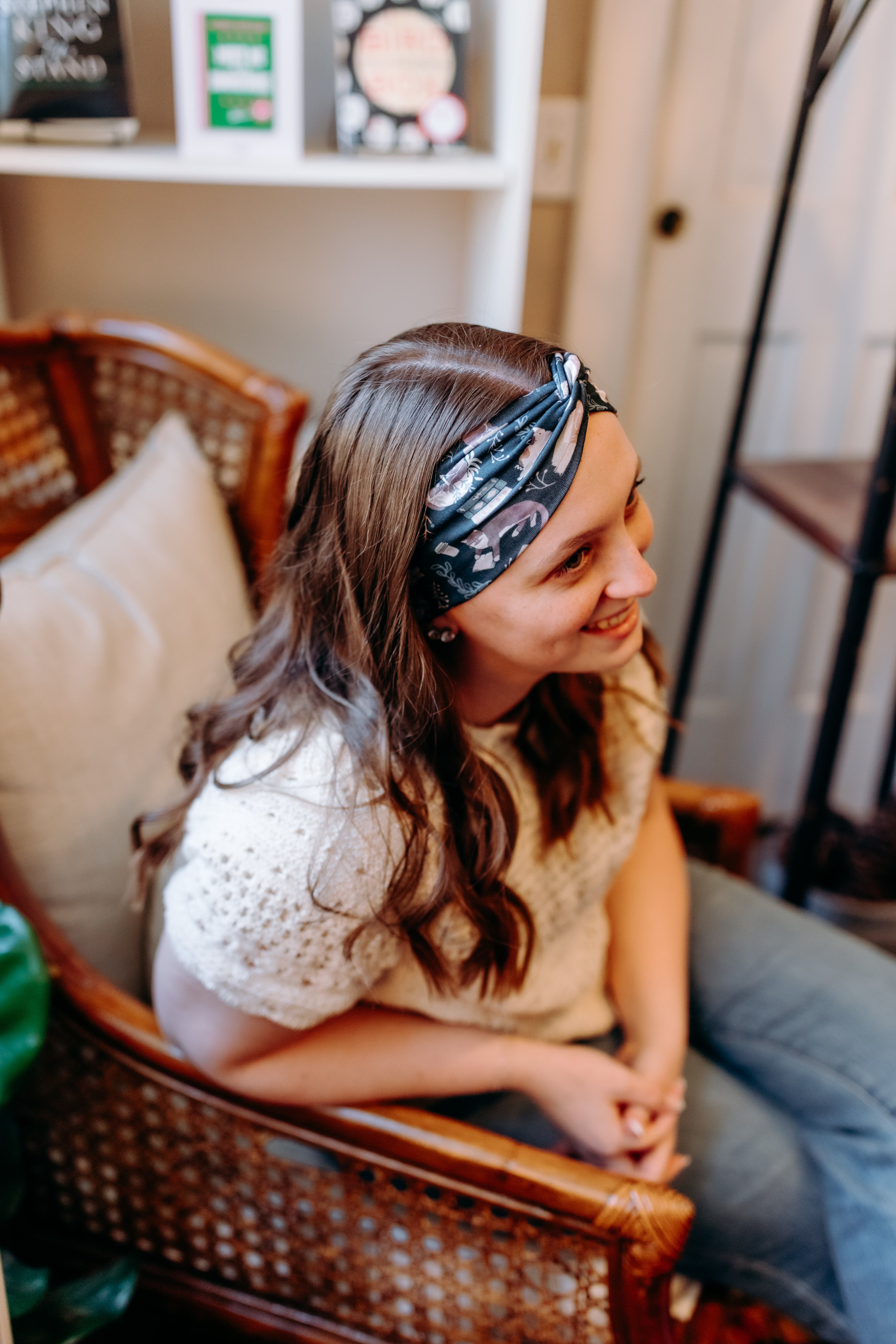 Woman confidently wearing the Lines, Vines & Felines headband for cute hairstyles and comfortable all-day wear.