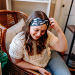Woman confidently wearing the Lines, Vines & Felines headband for cute hairstyles and comfortable all-day wear.