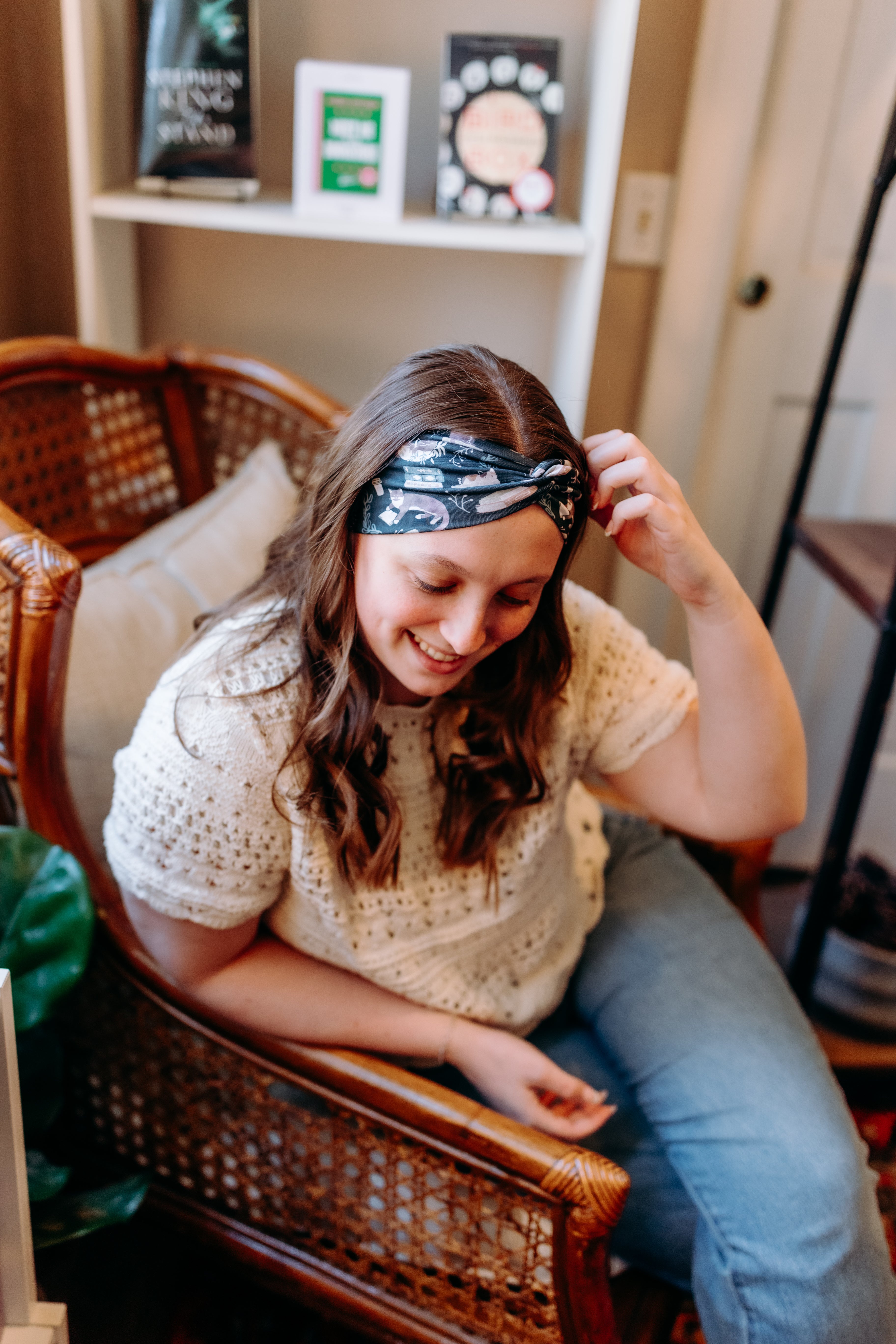 Woman confidently wearing the Lines, Vines & Felines headband for cute hairstyles and comfortable all-day wear.