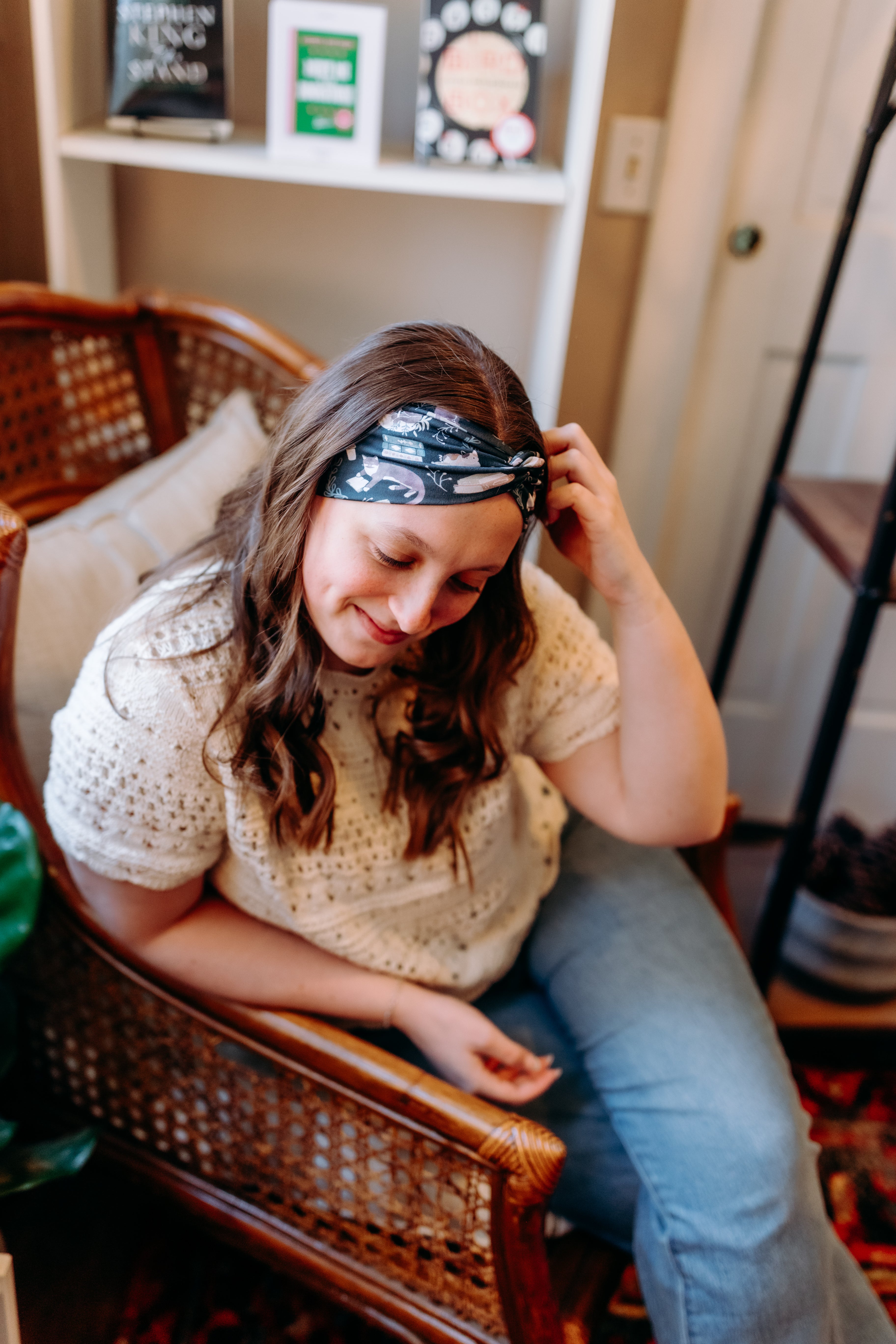 Woman confidently wearing the Lines, Vines & Felines headband for cute hairstyles and comfortable all-day wear.