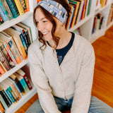 Woman confidently wearing the Fully Booked headband for cute hairstyles and comfortable all-day wear.