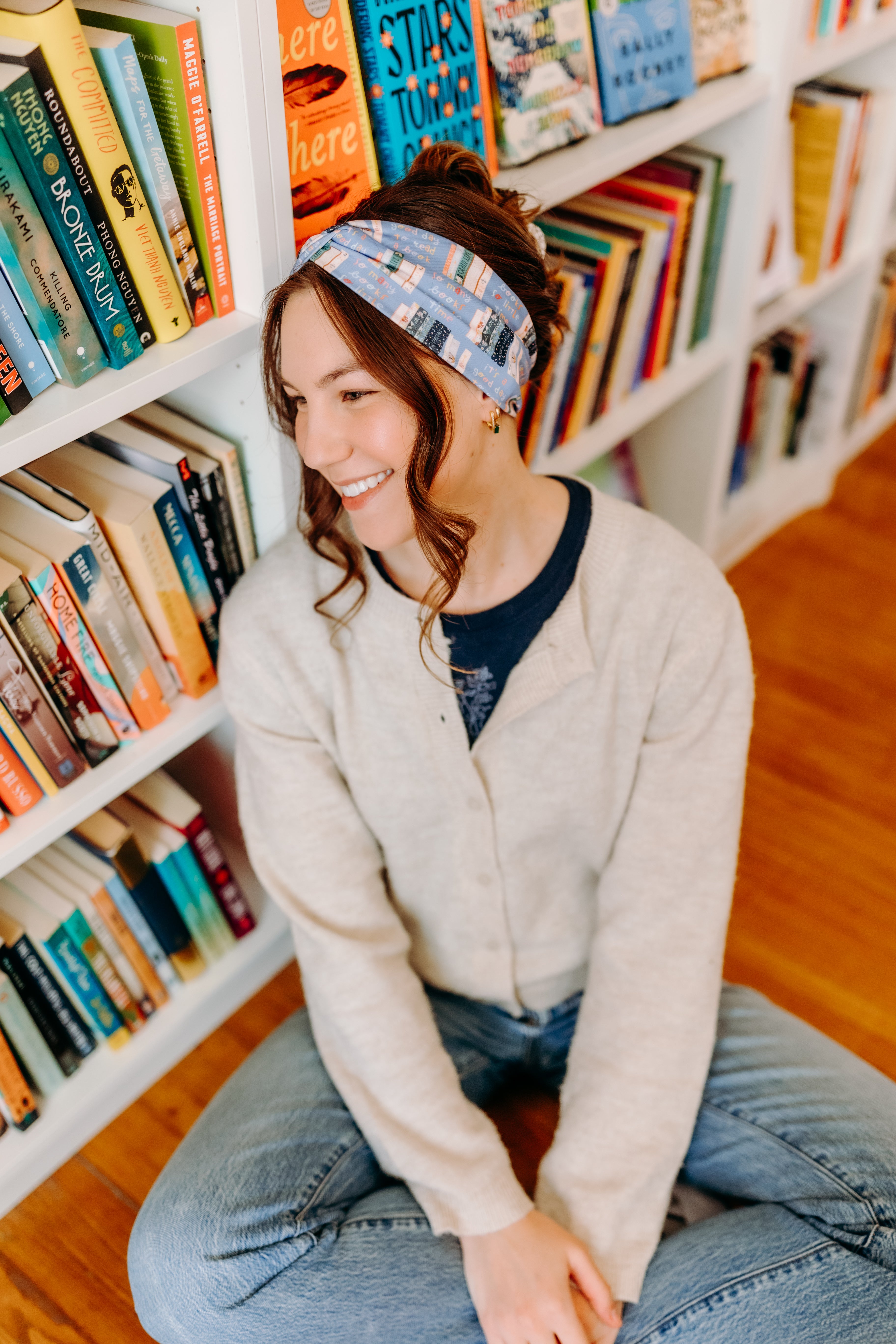 Woman confidently wearing the Fully Booked headband for cute hairstyles and comfortable all-day wear.