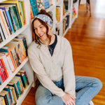 Woman confidently wearing the Fully Booked headband for cute hairstyles and comfortable all-day wear.