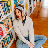 Woman confidently wearing the Fully Booked headband for cute hairstyles and comfortable all-day wear.