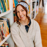 Woman confidently wearing the Fully Booked headband for cute hairstyles and comfortable all-day wear.