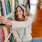 Woman confidently wearing the Fully Booked headband for cute hairstyles and comfortable all-day wear.