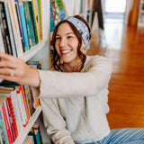 Woman confidently wearing the Fully Booked headband for cute hairstyles and comfortable all-day wear.