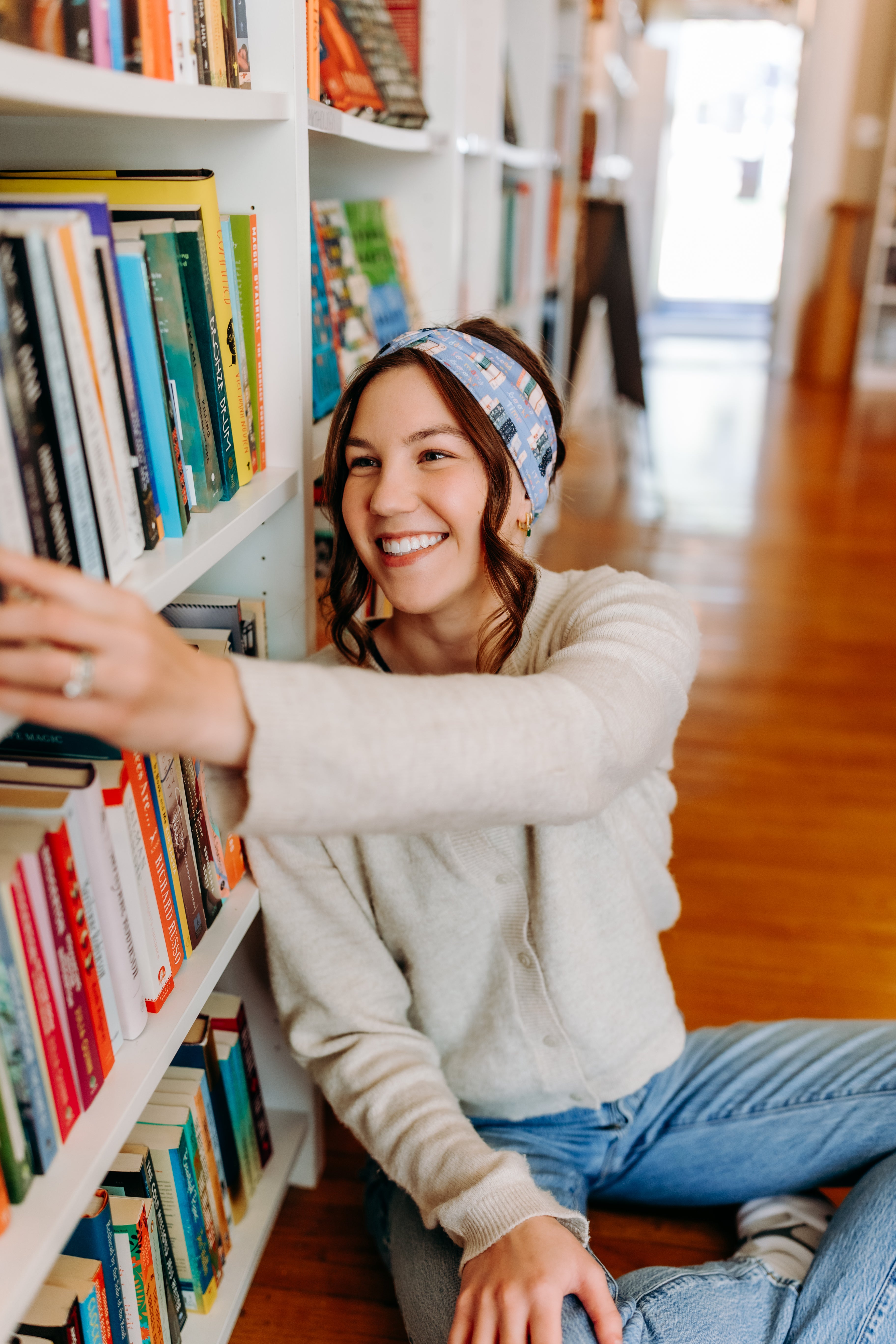 Woman confidently wearing the Fully Booked headband for cute hairstyles and comfortable all-day wear.