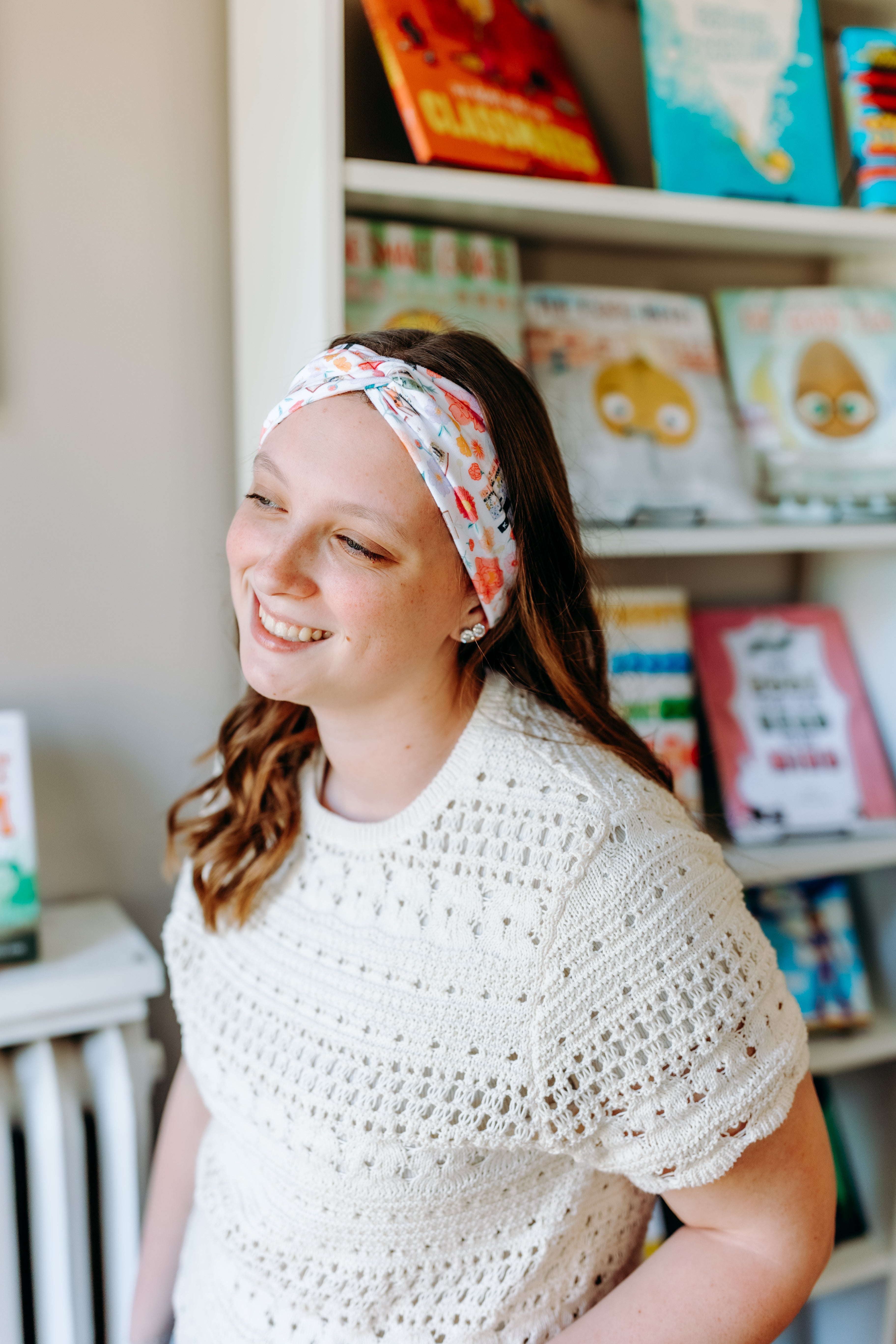 Woman confidently wearing the Pretty Pages headband for cute hairstyles and comfortable all-day wear.