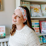 Woman confidently wearing the Pretty Pages headband for cute hairstyles and comfortable all-day wear.