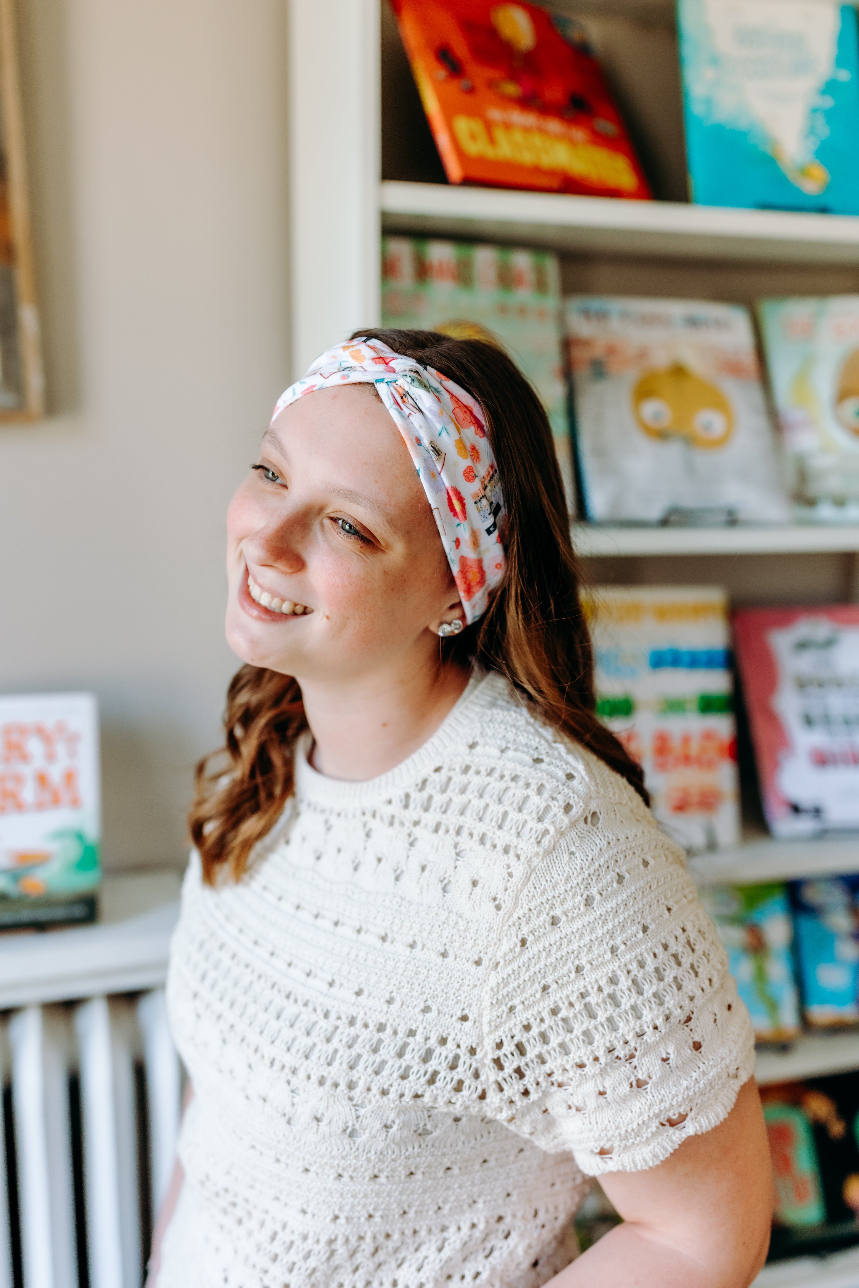 Woman confidently wearing the Pretty Pages headband for cute hairstyles and comfortable all-day wear.