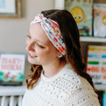 Woman confidently wearing the Pretty Pages headband for cute hairstyles and comfortable all-day wear.