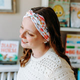 Woman confidently wearing the Pretty Pages headband for cute hairstyles and comfortable all-day wear.