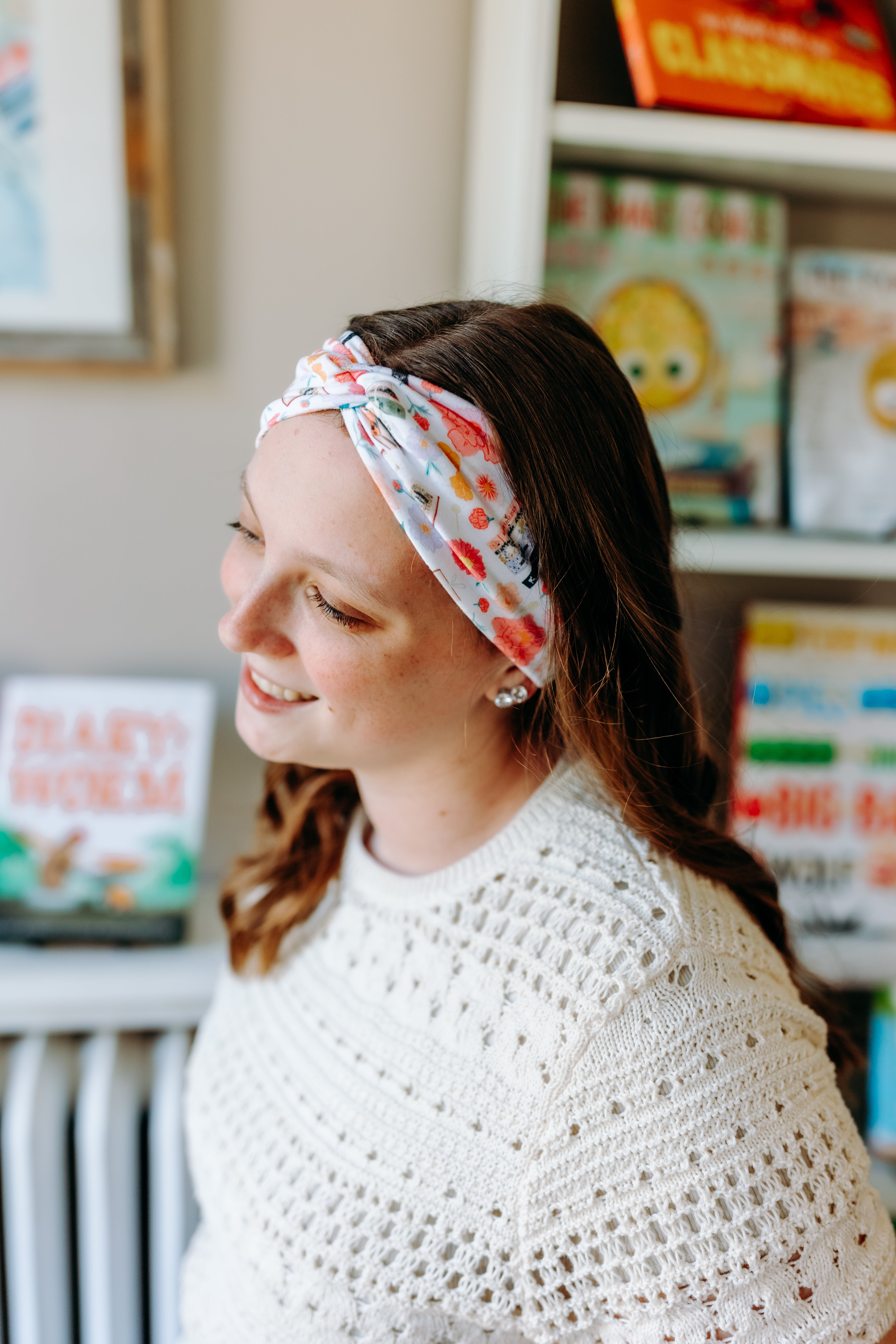 Woman confidently wearing the Pretty Pages headband for cute hairstyles and comfortable all-day wear.