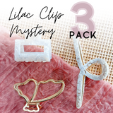 Adult women's mystery 3-pack with three surprise hair claw clips
