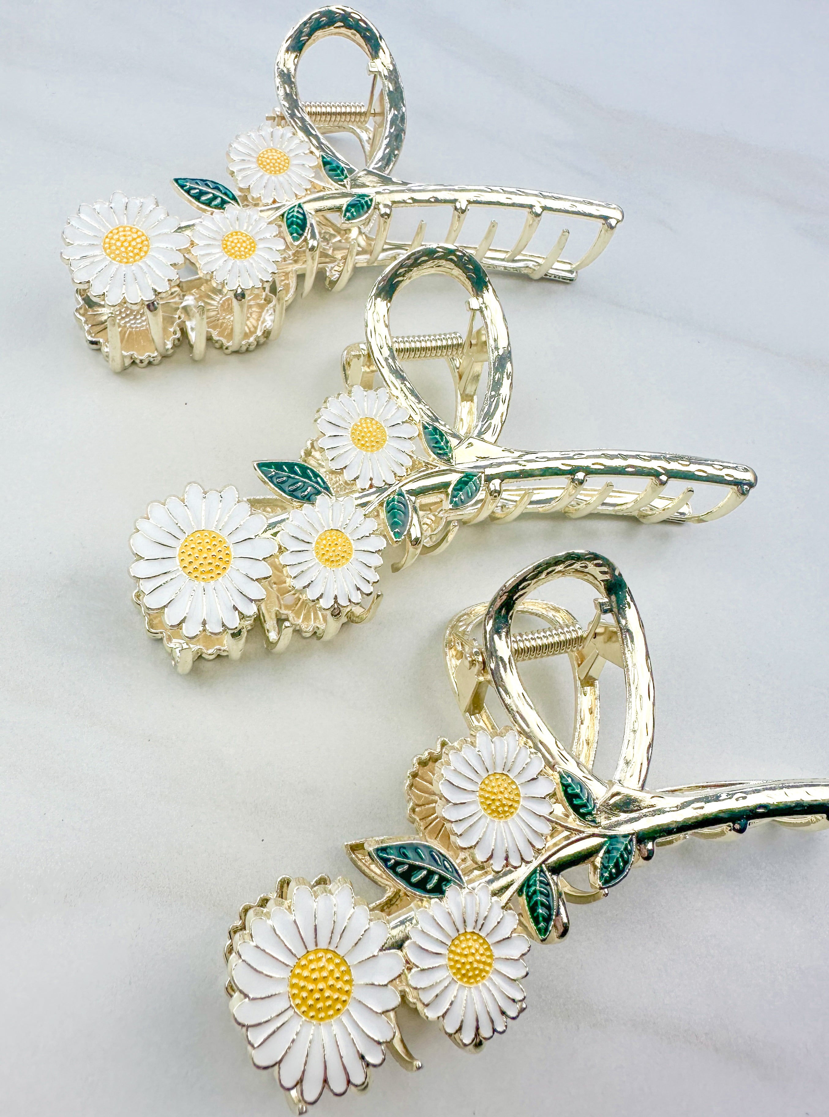 Grow With Grace Clip featuring a three white daisy flowers on a metal hair clip with hinge closure, part of The Sarah Wallace Collection.