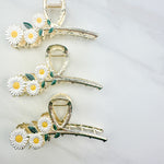 Grow With Grace Clip featuring a three white daisy flowers on a metal hair clip with hinge closure, part of The Sarah Wallace Collection.