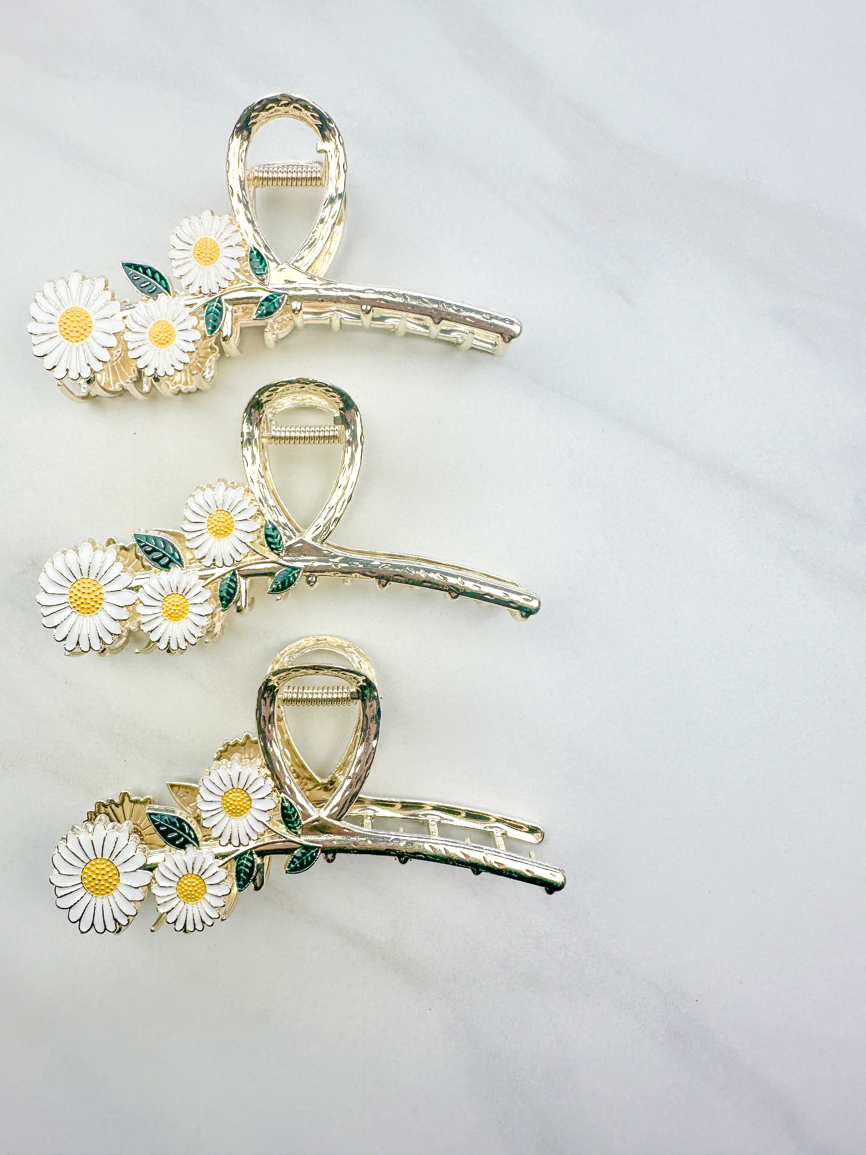 Grow With Grace Clip featuring a three white daisy flowers on a metal hair clip with hinge closure, part of The Sarah Wallace Collection.