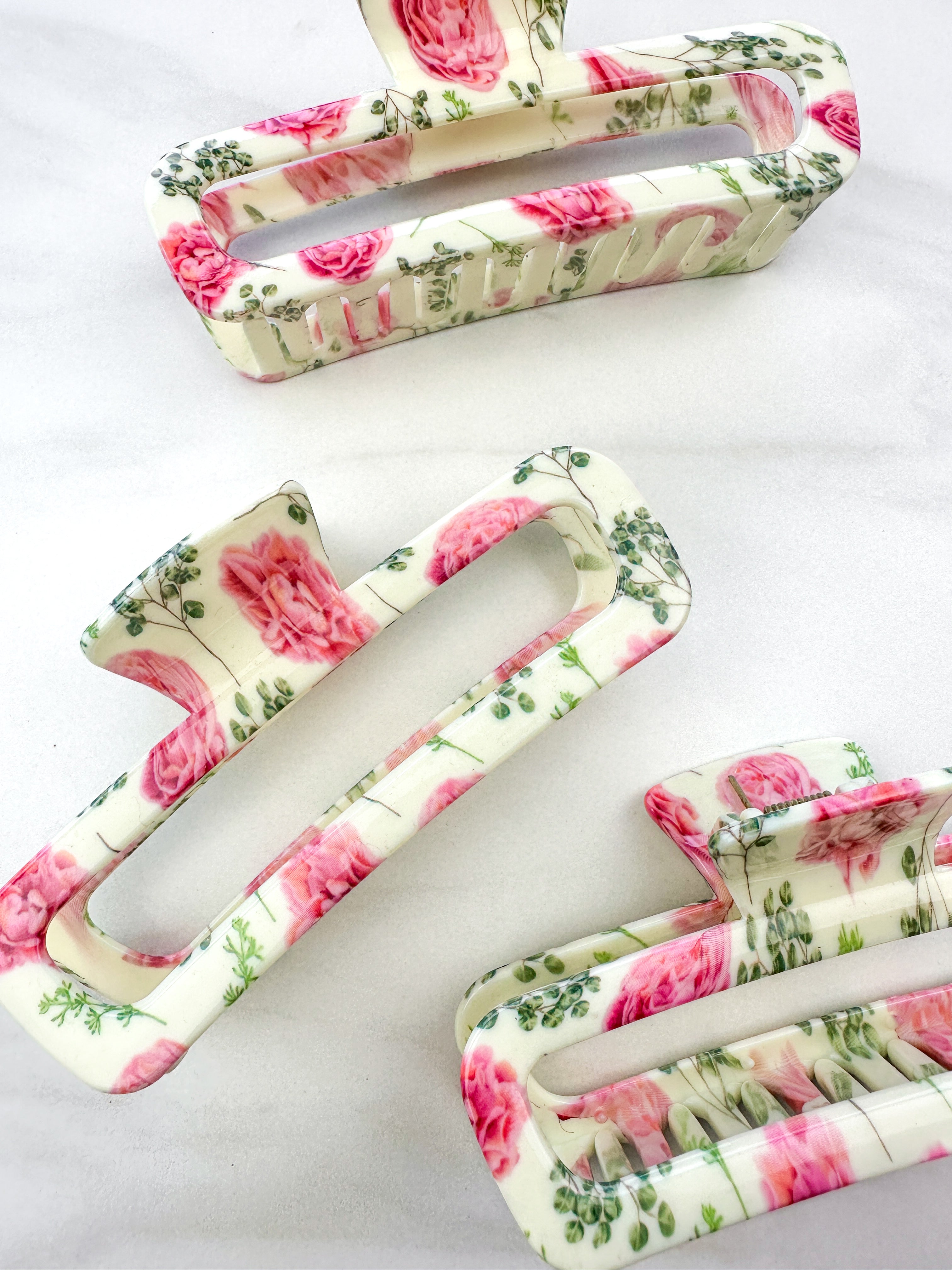 No Rain, No Flowers Clip featuring a pink peony floral design, glossy material, and hinge closure from The Sarah Wallace Collection.