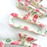 No Rain, No Flowers Clip featuring a pink peony floral design, glossy material, and hinge closure from The Sarah Wallace Collection.