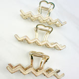 New York Minute: A 4.2-inch metal hair clip with a hinge closure, part of the Sarah Wallace Collection.