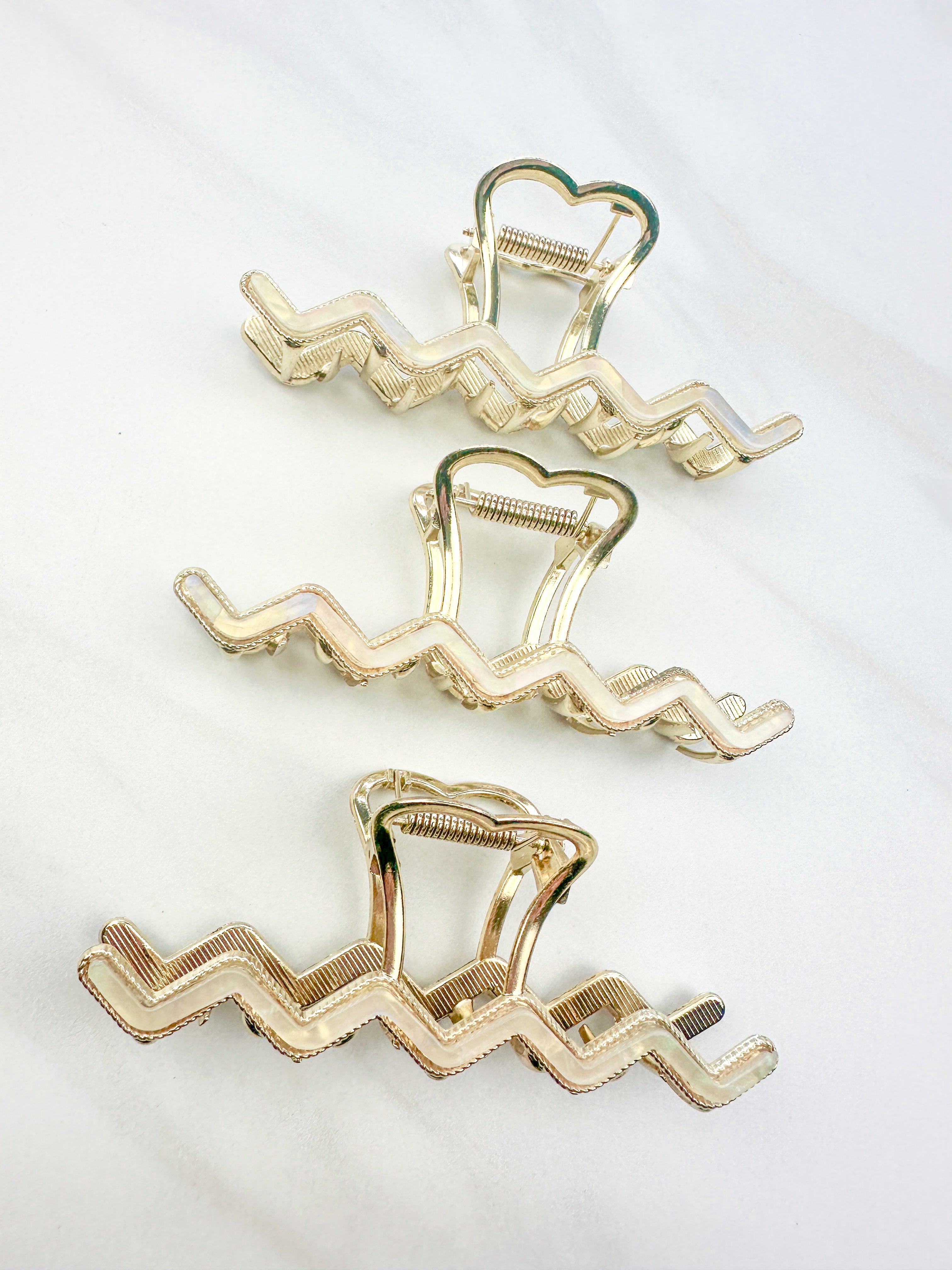 New York Minute: A 4.2-inch metal hair clip with a hinge closure, part of the Sarah Wallace Collection.